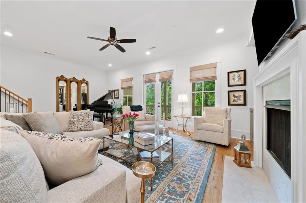 1045 Endeavour Court Marietta, GA 30064 - Photo 5 of 39 a living room with furniture and a flat screen tv