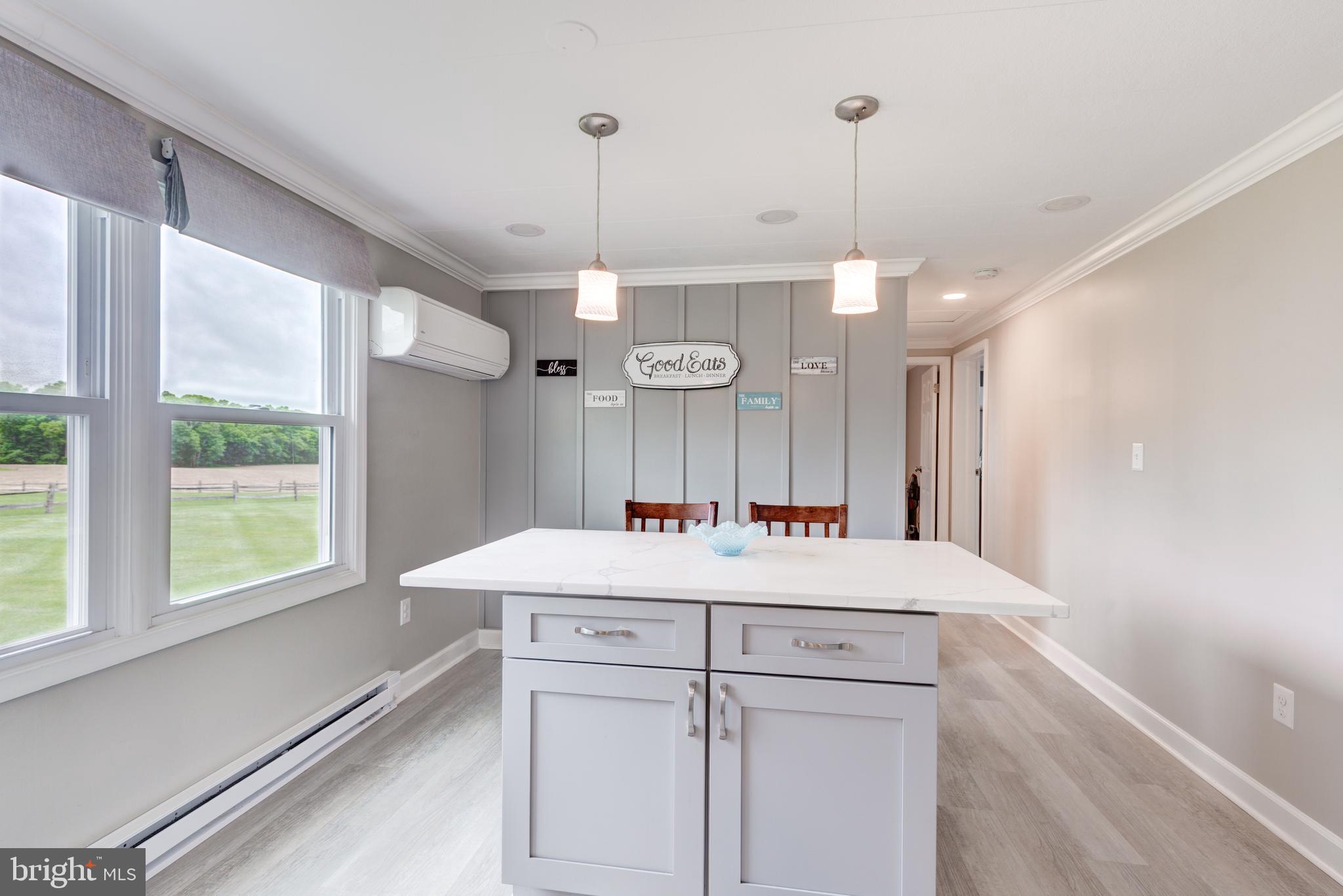 3801 Carrollton Road Upperco, MD 21155 - Photo 25 of 75 a view of a kitchen island a chandelier furniture and kitchen view