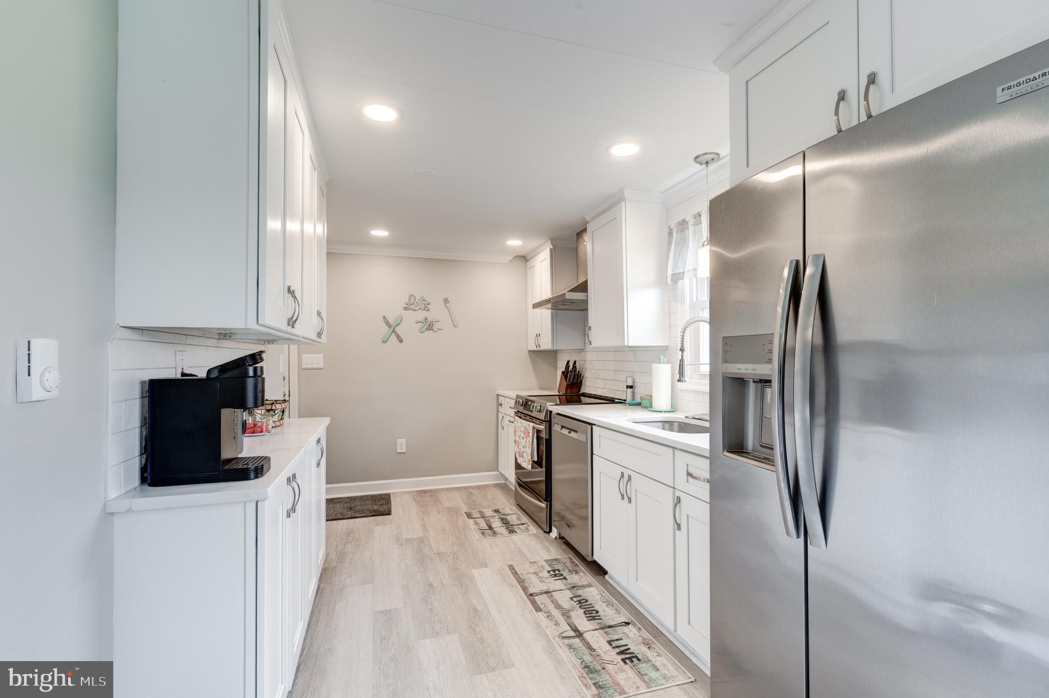 3801 Carrollton Road Upperco, MD 21155 - Photo 26 of 75 a kitchen with stainless steel appliances granite countertop a refrigerator a stove and a sink
