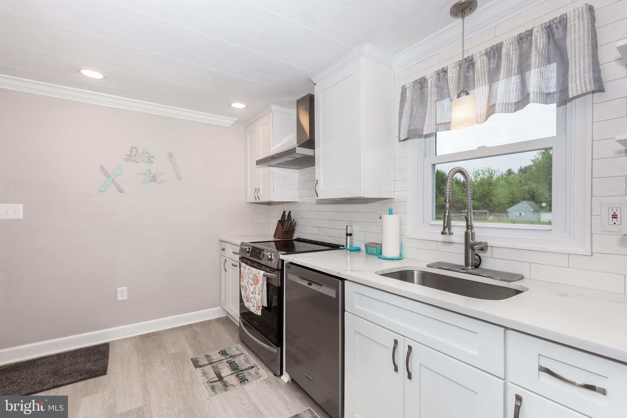 3801 Carrollton Road Upperco, MD 21155 - Photo 28 of 75 a kitchen with a sink and cabinets