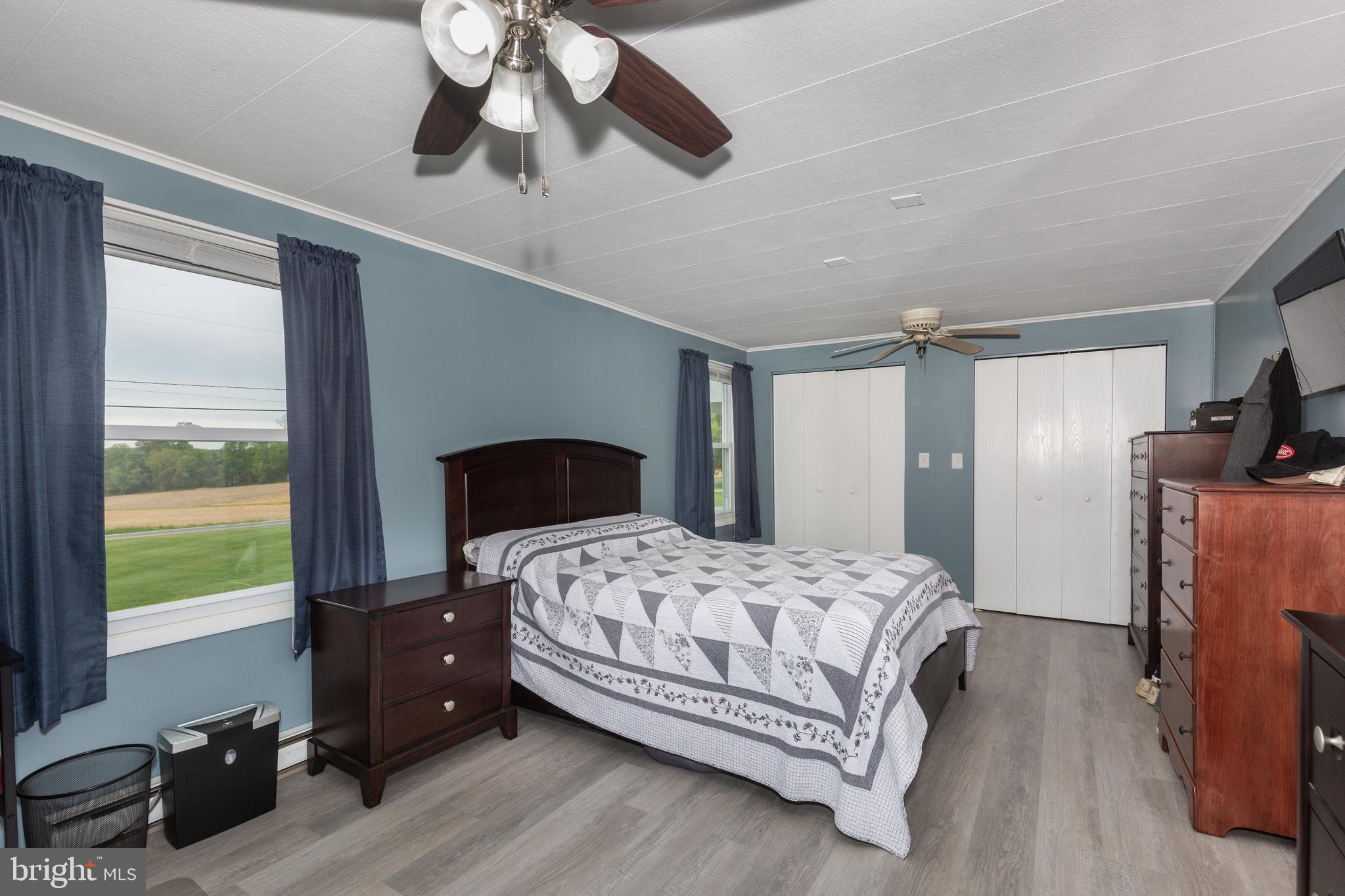 3801 Carrollton Road Upperco, MD 21155 - Photo 37 of 75 a bedroom with a bed and wooden floor