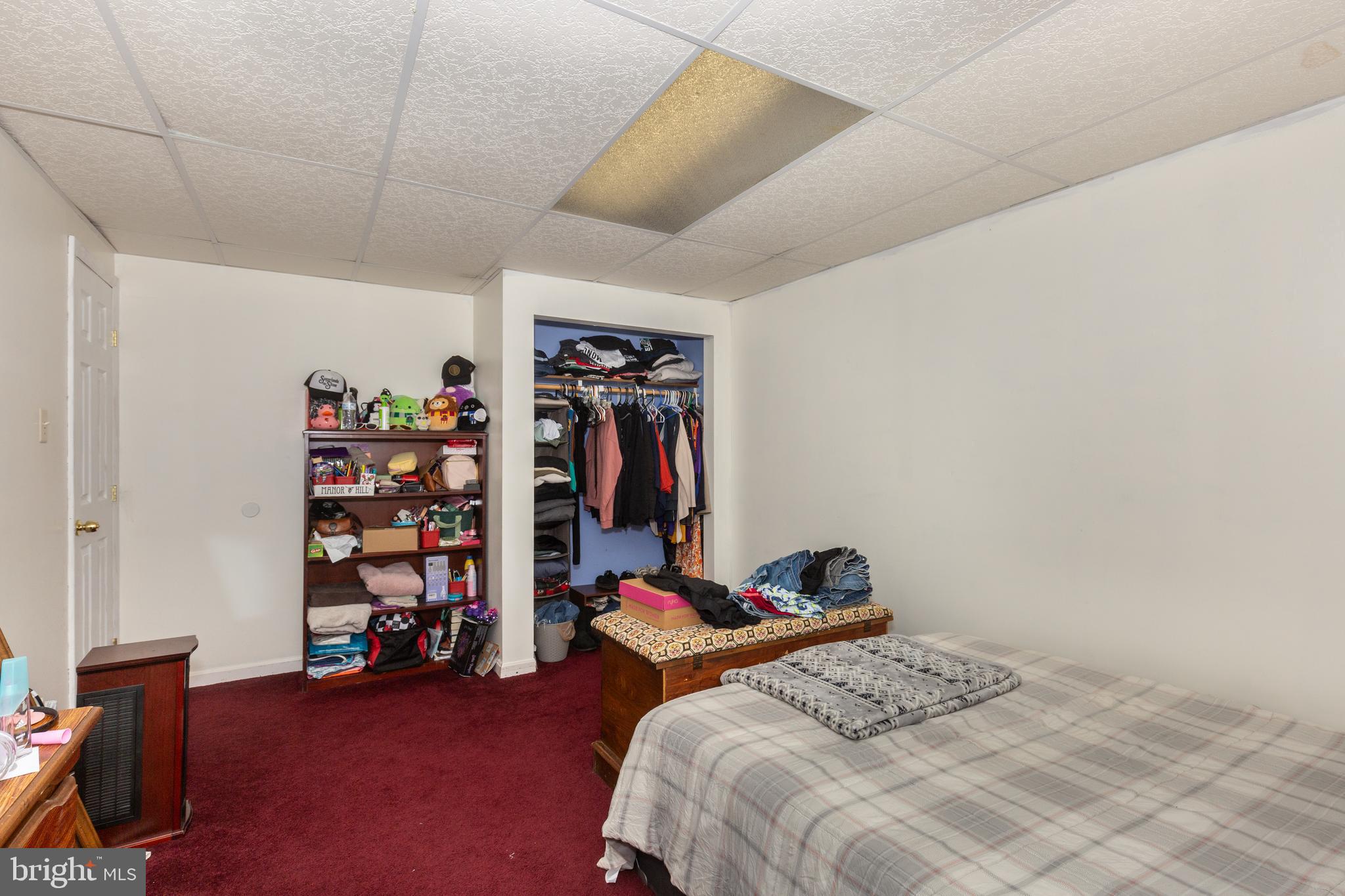 3801 Carrollton Road Upperco, MD 21155 - Photo 43 of 75 a bedroom with a bed and a bookshelf