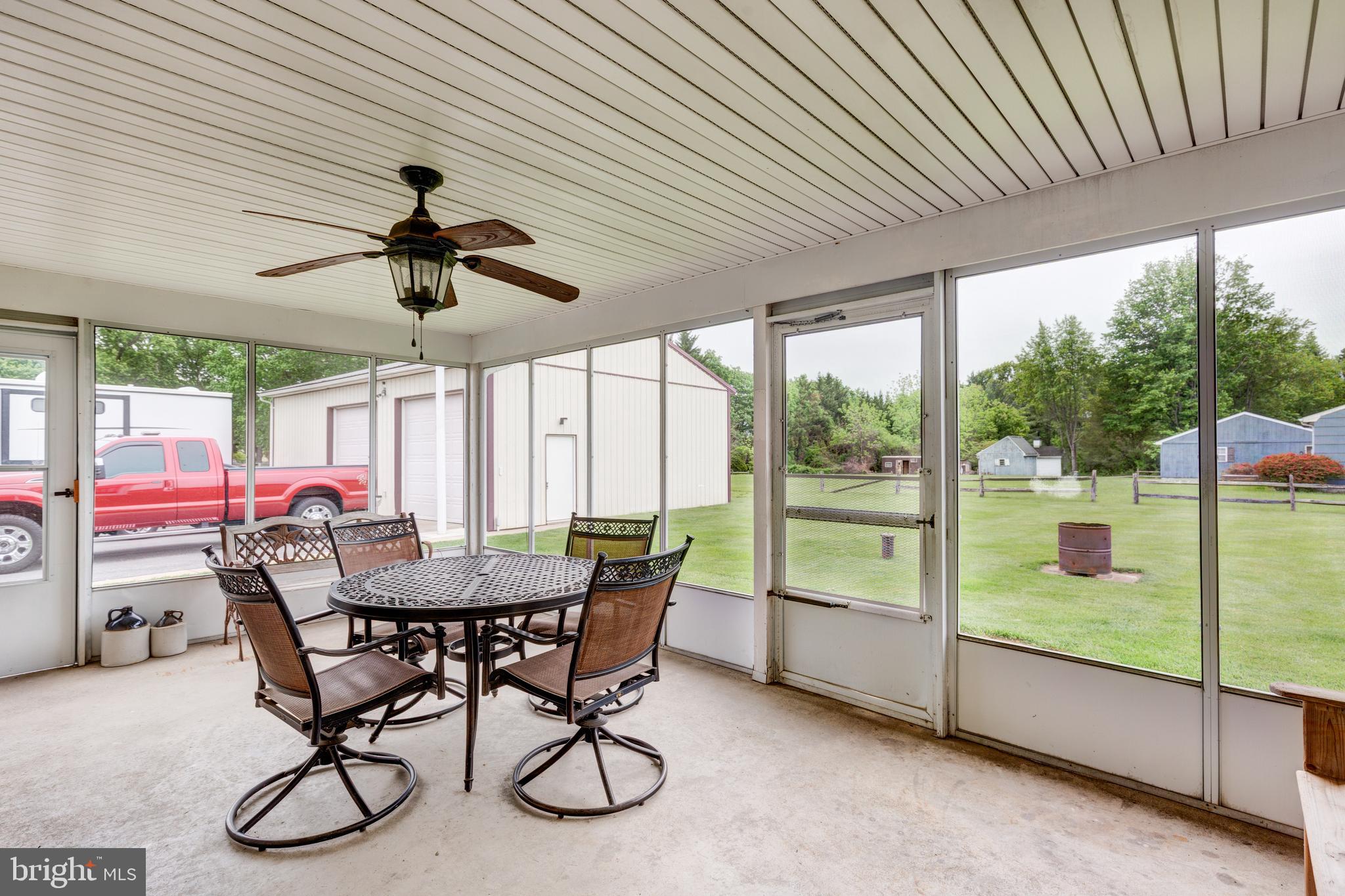 3801 Carrollton Road Upperco, MD 21155 - Photo 49 of 75 a dining room with furniture water view and a floor to ceiling window