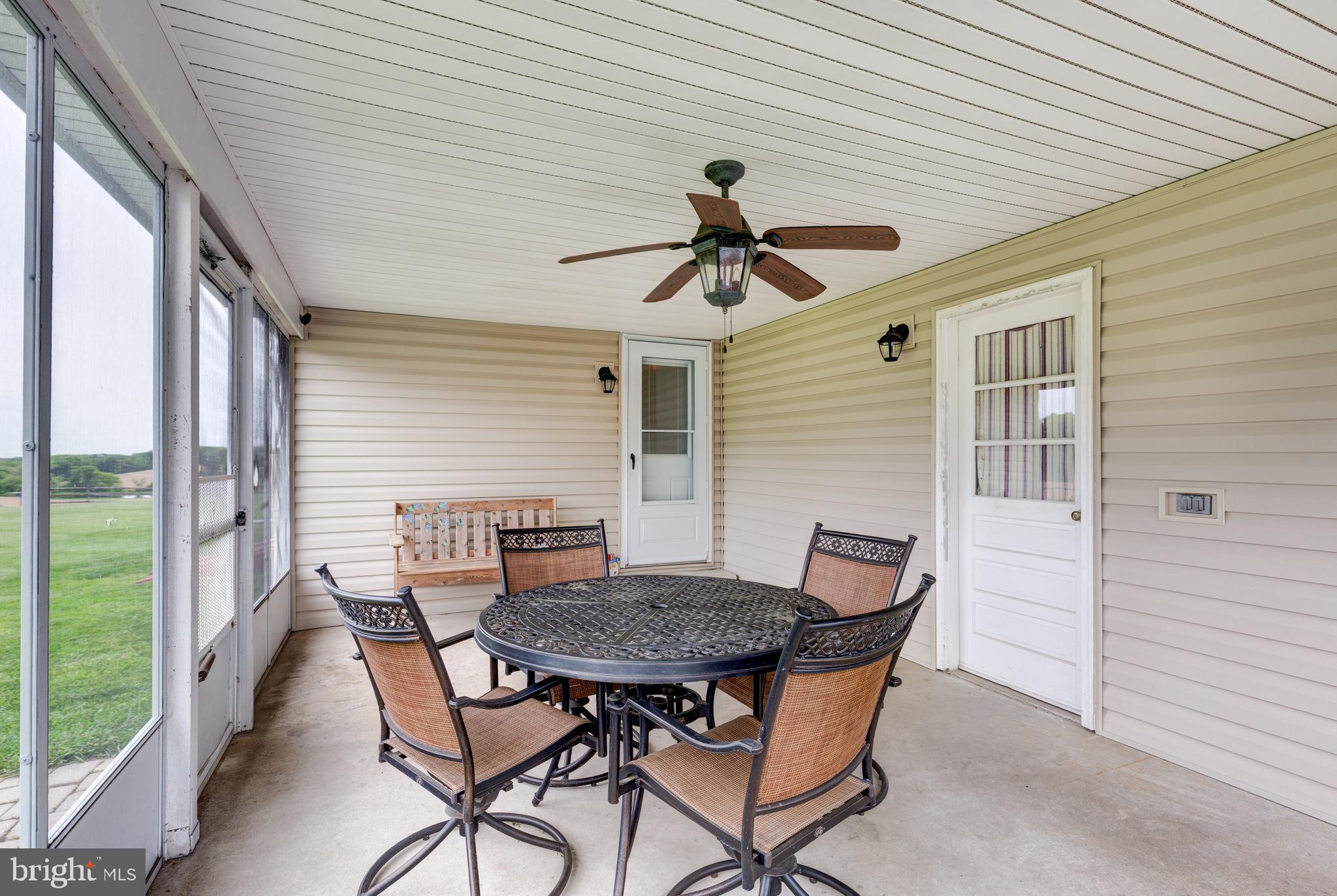 3801 Carrollton Road Upperco, MD 21155 - Photo 50 of 75 a view of a patio with a table and chairs