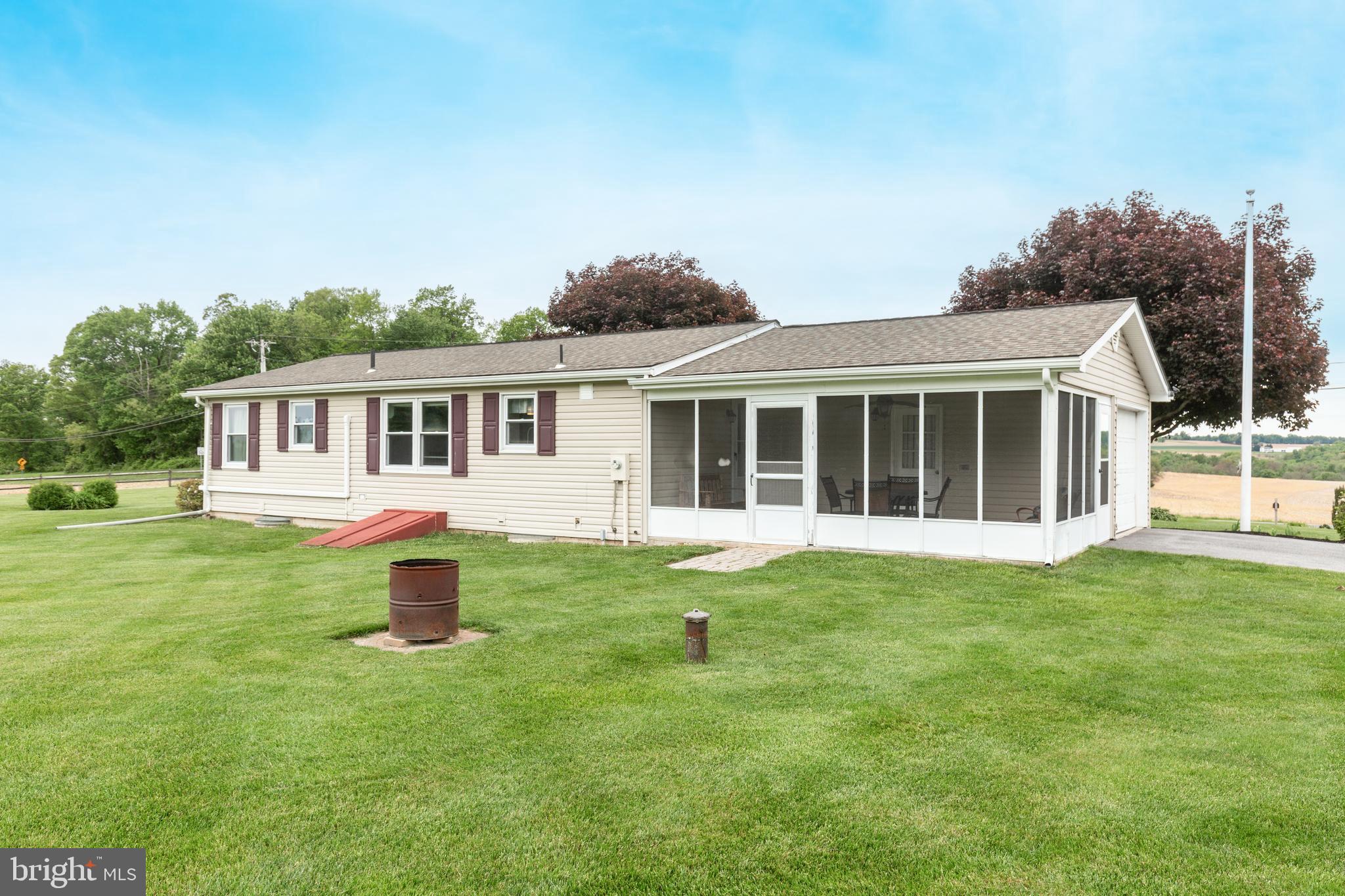 3801 Carrollton Road Upperco, MD 21155 - Photo 60 of 75 a front view of a house with a yard