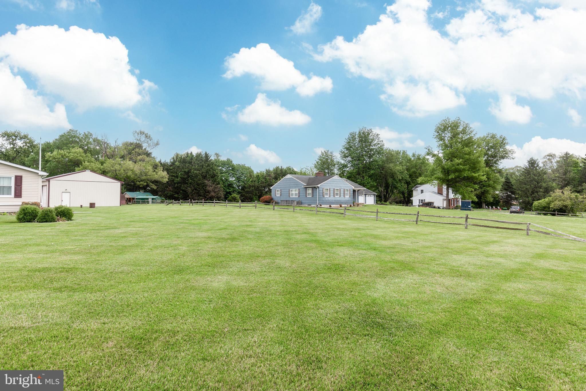 3801 Carrollton Road Upperco, MD 21155 - Photo 66 of 75 a view of a green field with wooden fence