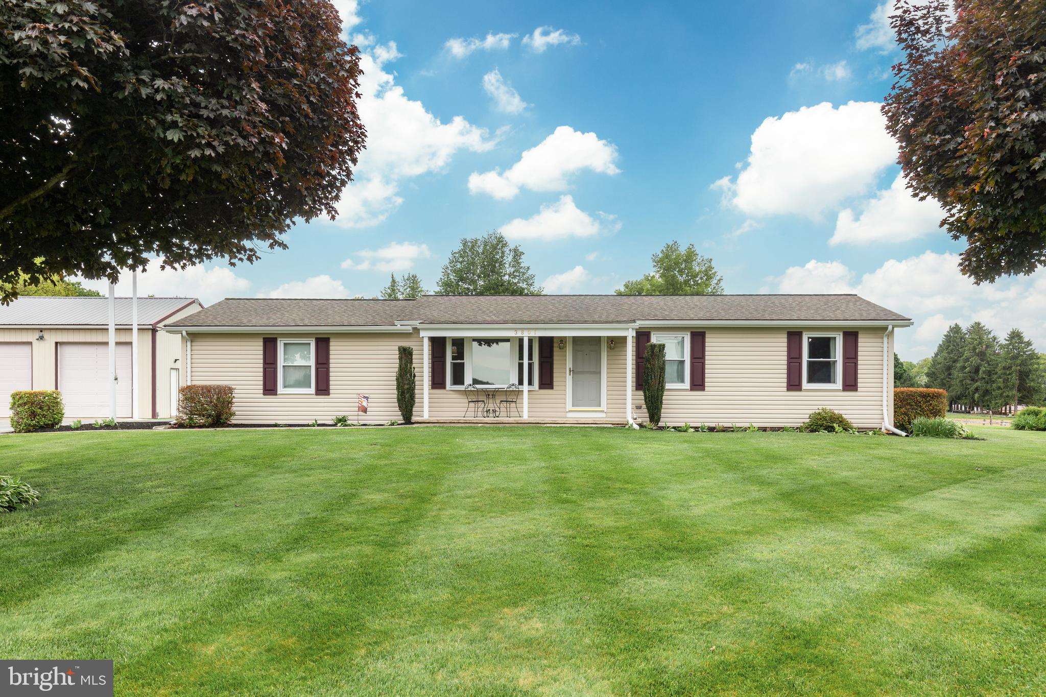 3801 Carrollton Road Upperco, MD 21155 - Photo 71 of 75 a front view of a house with a garden and trees