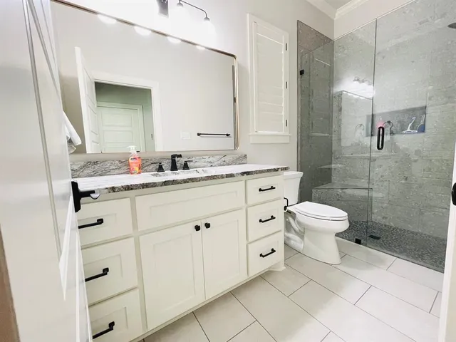 a front view of a house with yard and green space