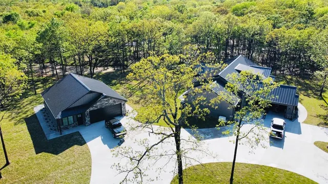 a picture of a table and chairs with potted plants