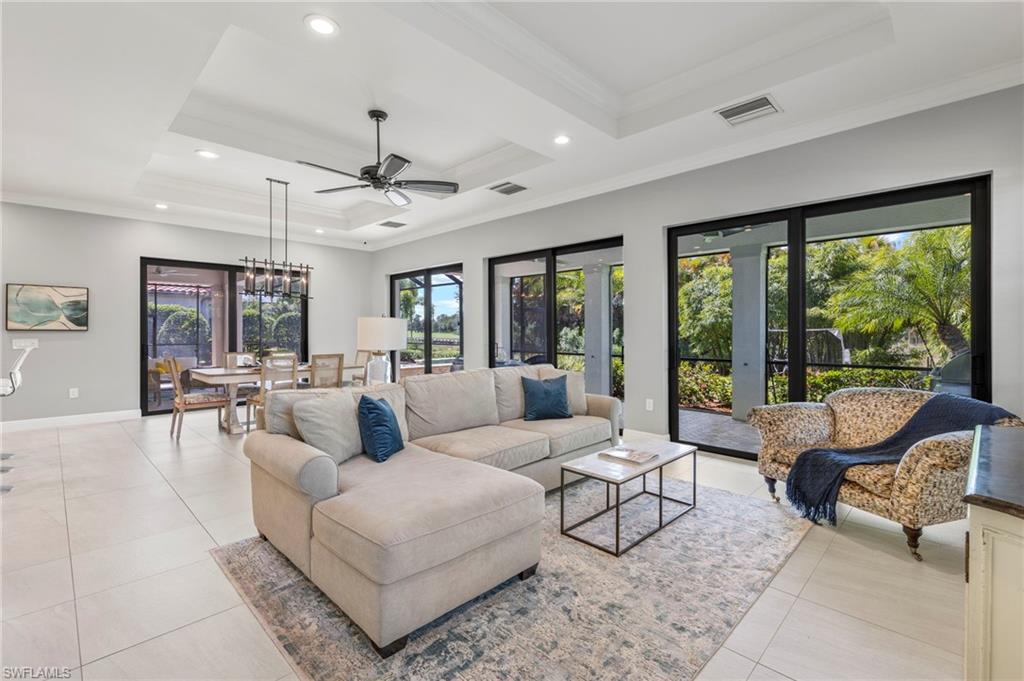 14517 Marsala Way Naples, FL 34109 - Photo 12 of 33 a living room with furniture and a large window