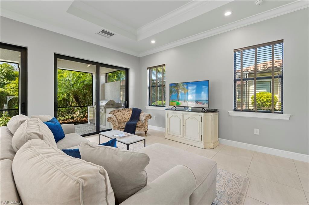 14517 Marsala Way Naples, FL 34109 - Photo 13 of 33 a living room with furniture and a large window