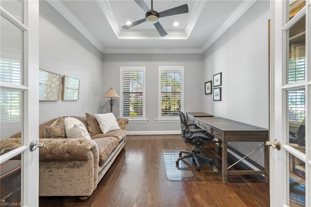 14517 Marsala Way Naples, FL 34109 - Photo 14 of 33 a living room with furniture and wooden floor