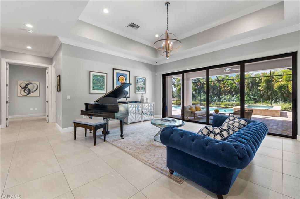 14517 Marsala Way Naples, FL 34109 - Photo 2 of 33 a living room with furniture and a large window