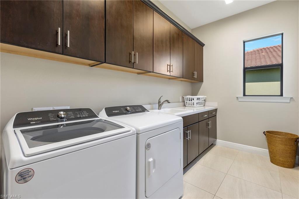 14517 Marsala Way Naples, FL 34109 - Photo 28 of 33 a utility room with dryer and washer