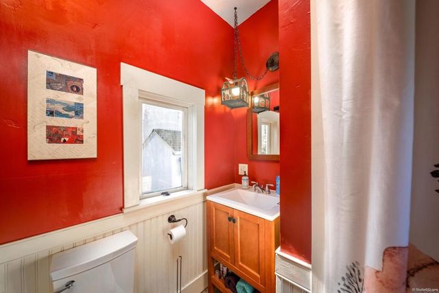 a bathroom with a sink a mirror and a vanity