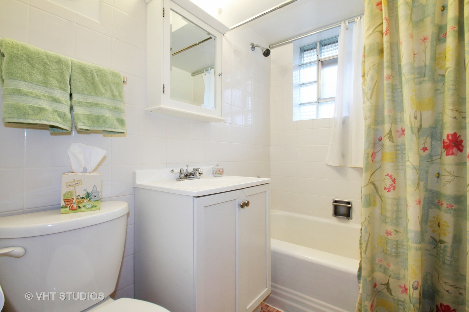 8019 Wisner Street Niles, IL 60714 - Photo 8 of 11 a bathroom with a sink toilet and shower