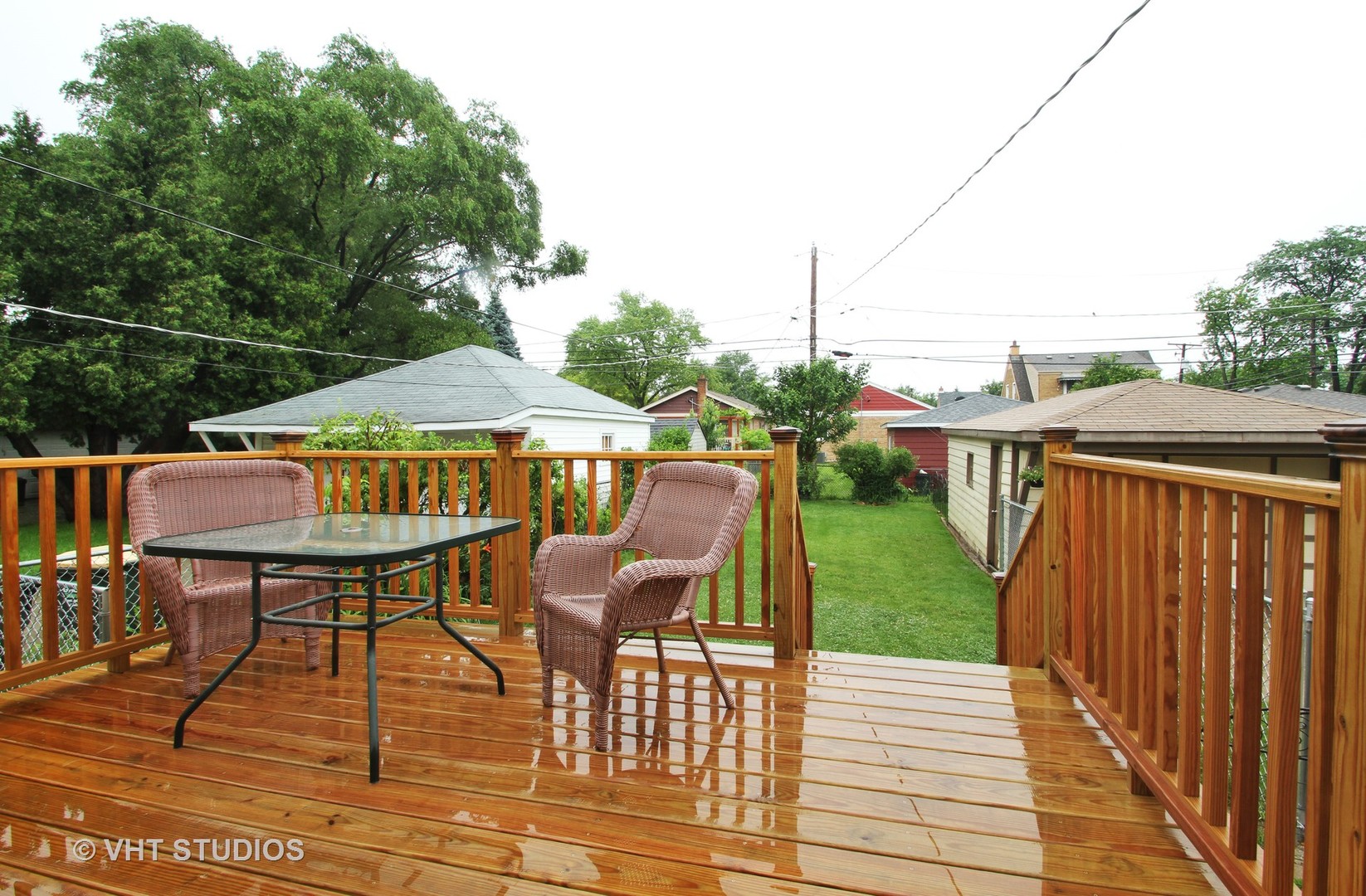 8019 Wisner Street Niles, IL 60714 - Photo 10 of 11 a view of a patio with table and chairs with wooden floor and fence