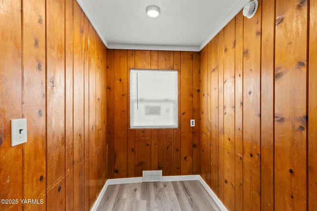 a view of a bathroom with shower and a window