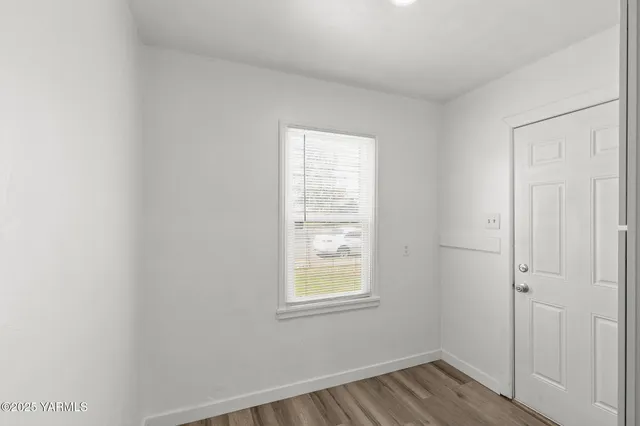 a view of a room that has a window in it