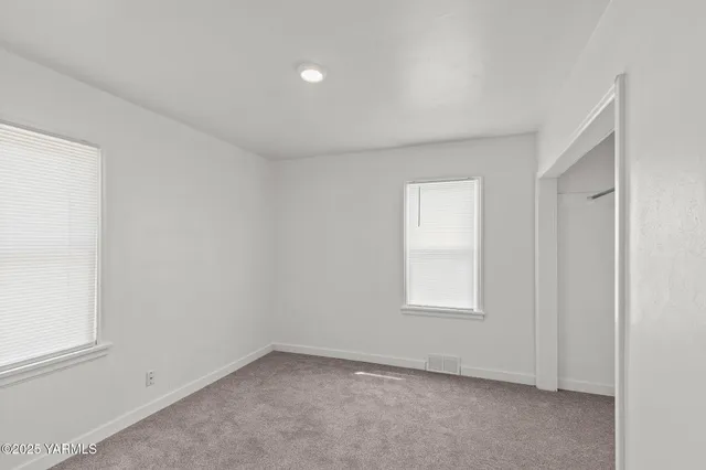 an empty room with windows