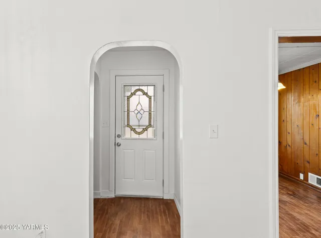 a view of front door with wooden floor