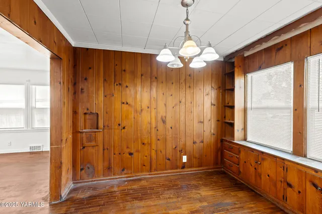 a view of a room with window chandelier