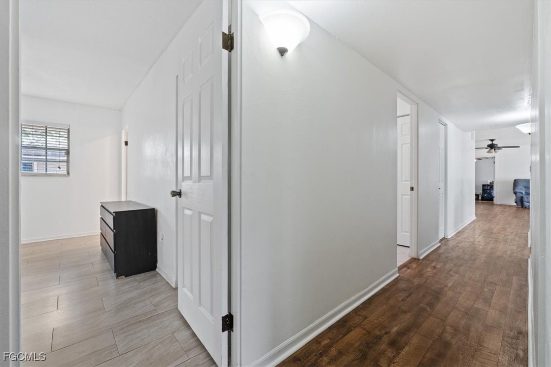 610 East Avenida Del Rio Clewiston, FL 33440 - Photo 35 of 49 a view of hallway with wooden floor