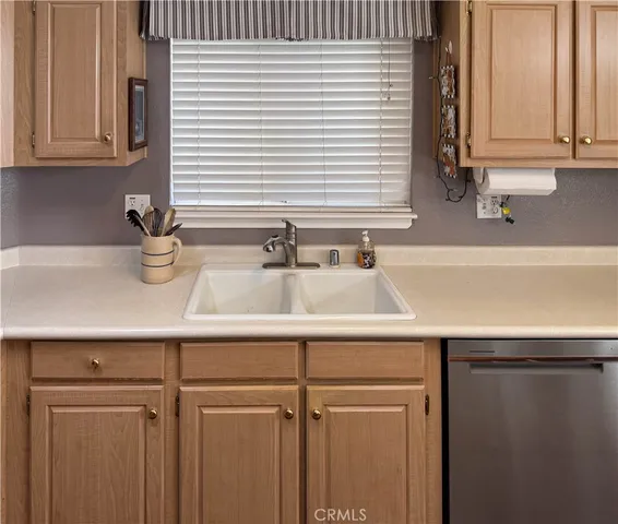 a bathroom with a sink and a window