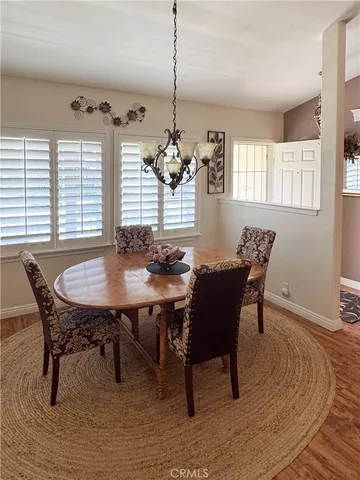 a view of a dining room with furniture and window