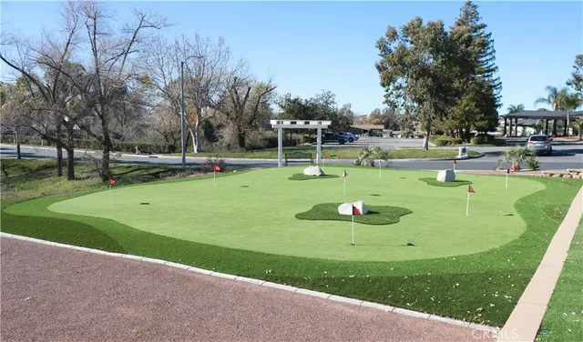 a view of a swimming pool with a lounge chairs