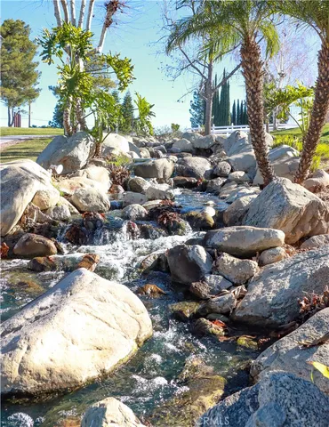 a view of lake with house in background