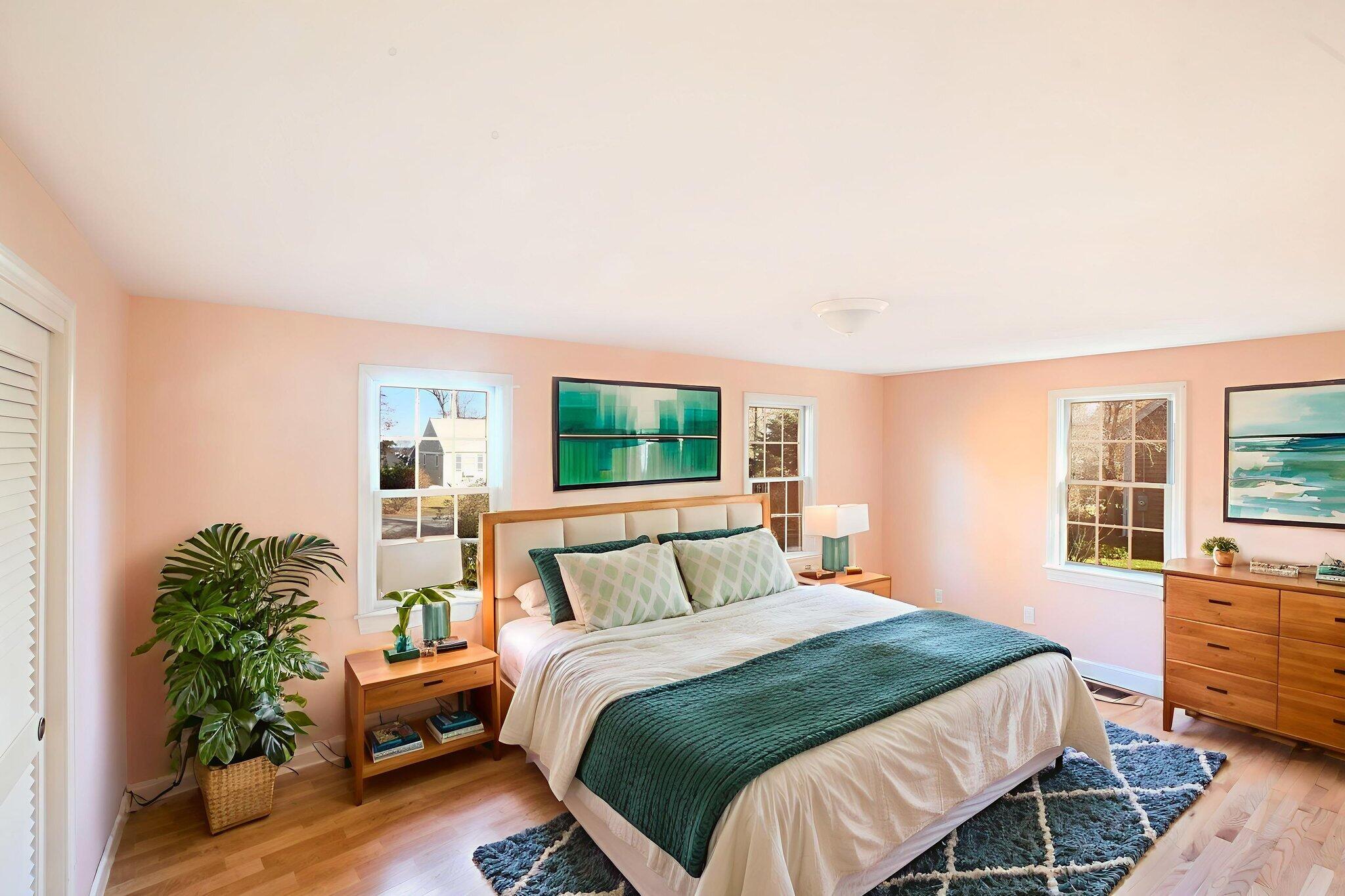 12 Crowell Road Sandwich, MA 02563 - Photo 14 of 49 a bedroom with a large bed and a potted plant