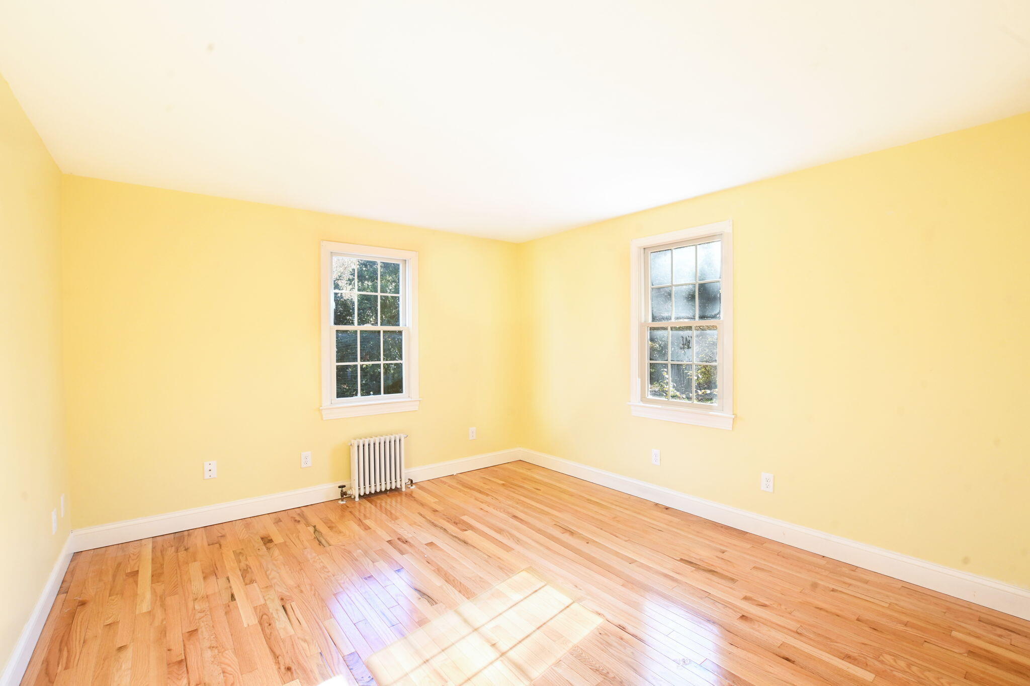 12 Crowell Road Sandwich, MA 02563 - Photo 17 of 49 a view of empty room with wooden floor and fan