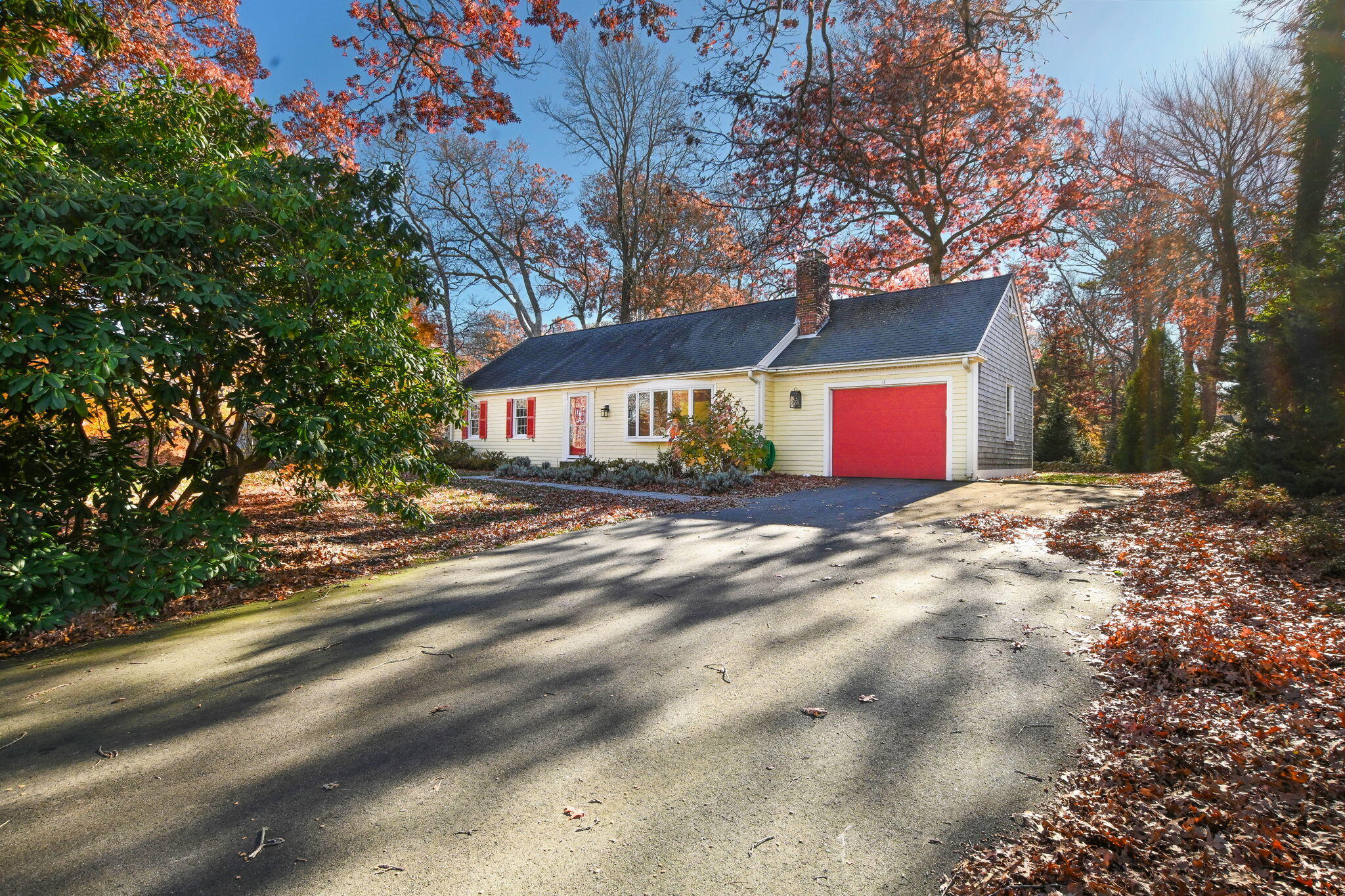 12 Crowell Road Sandwich, MA 02563 - Photo 2 of 49 a front view of a house with a yard and tree s