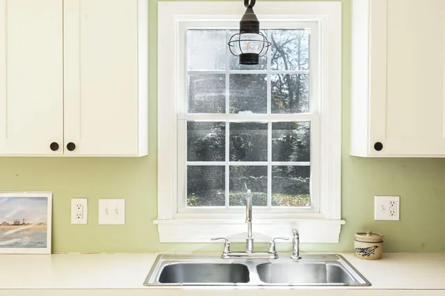 a kitchen with a sink and a window