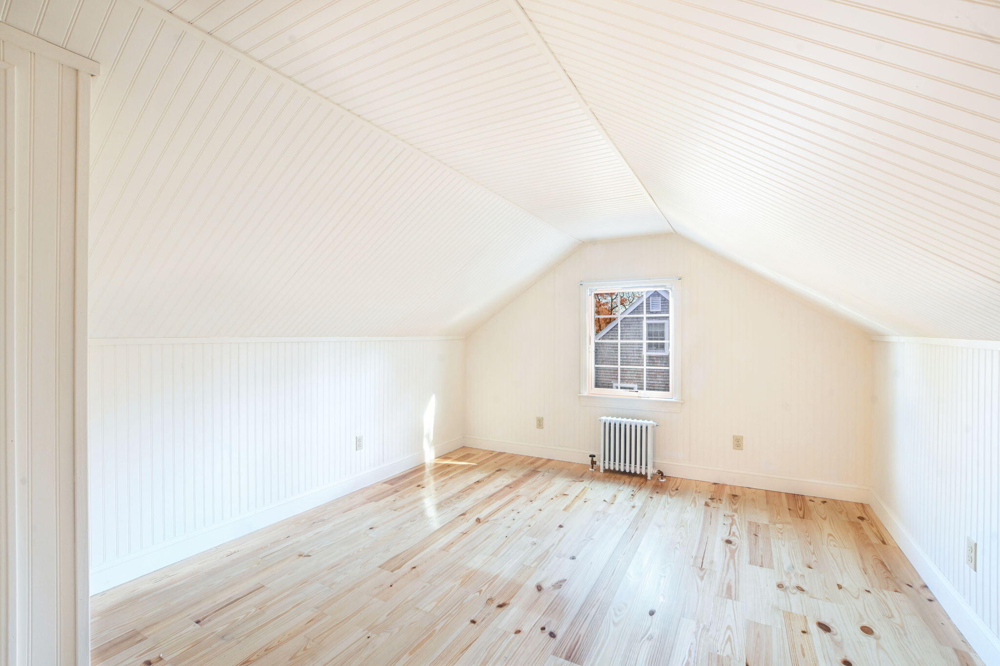 12 Crowell Road Sandwich, MA 02563 - Photo 29 of 49 an empty room with wooden floor and white walls