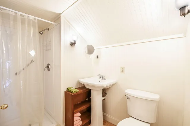 a view of staircase with white walls