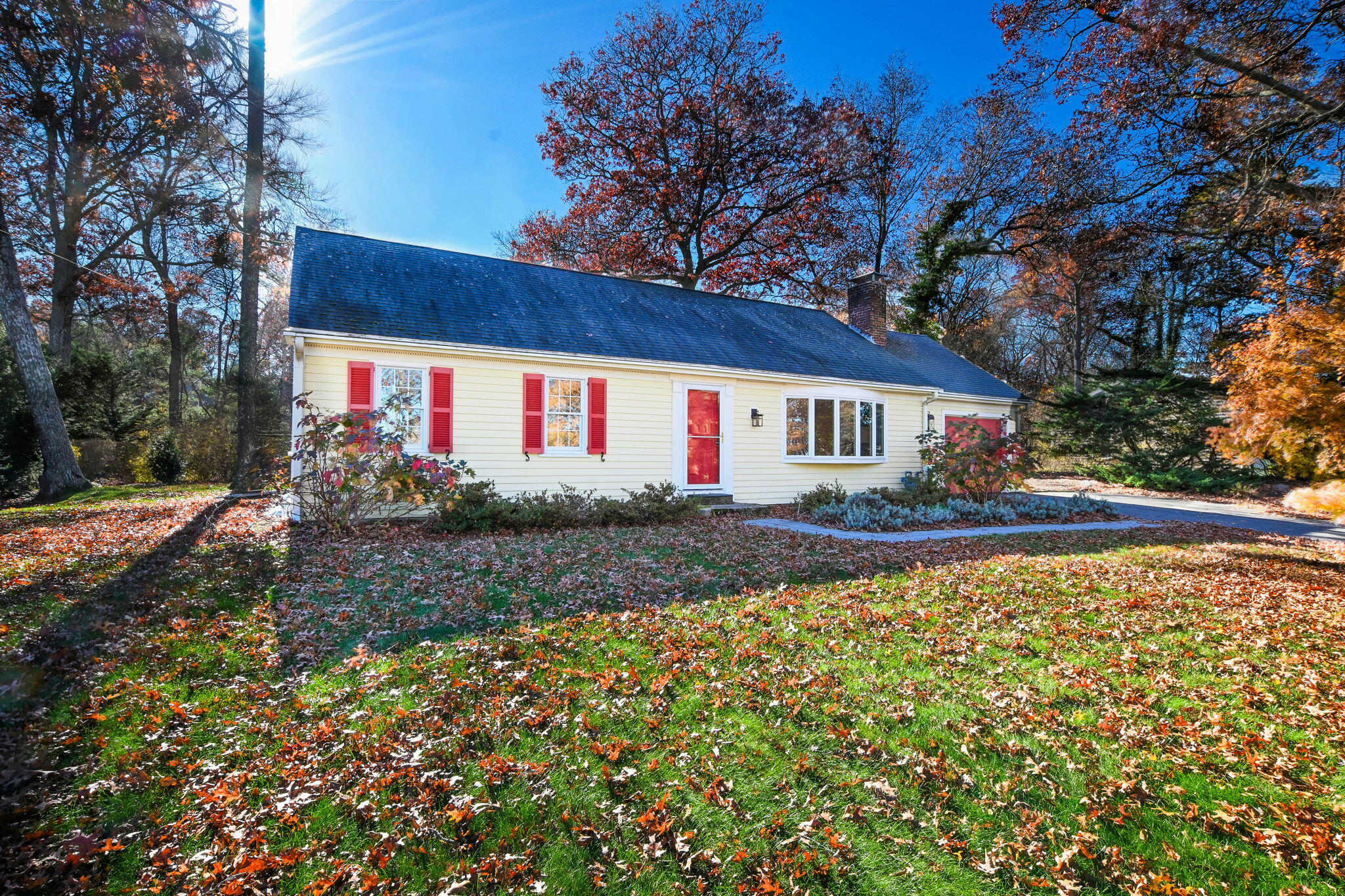 12 Crowell Road Sandwich, MA 02563 - Photo 35 of 49 a front view of house with yard and trees around
