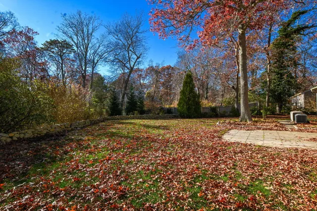 a balcony with wooden floor and city view