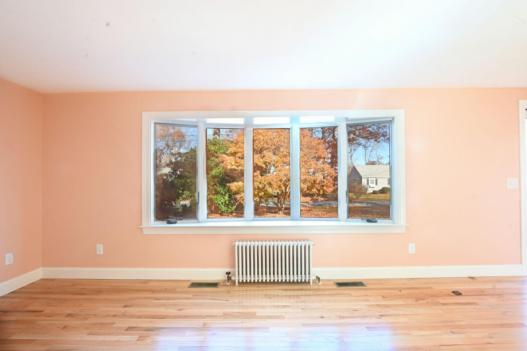 12 Crowell Road Sandwich, MA 02563 - Photo 8 of 49 an empty room with wooden floor and windows