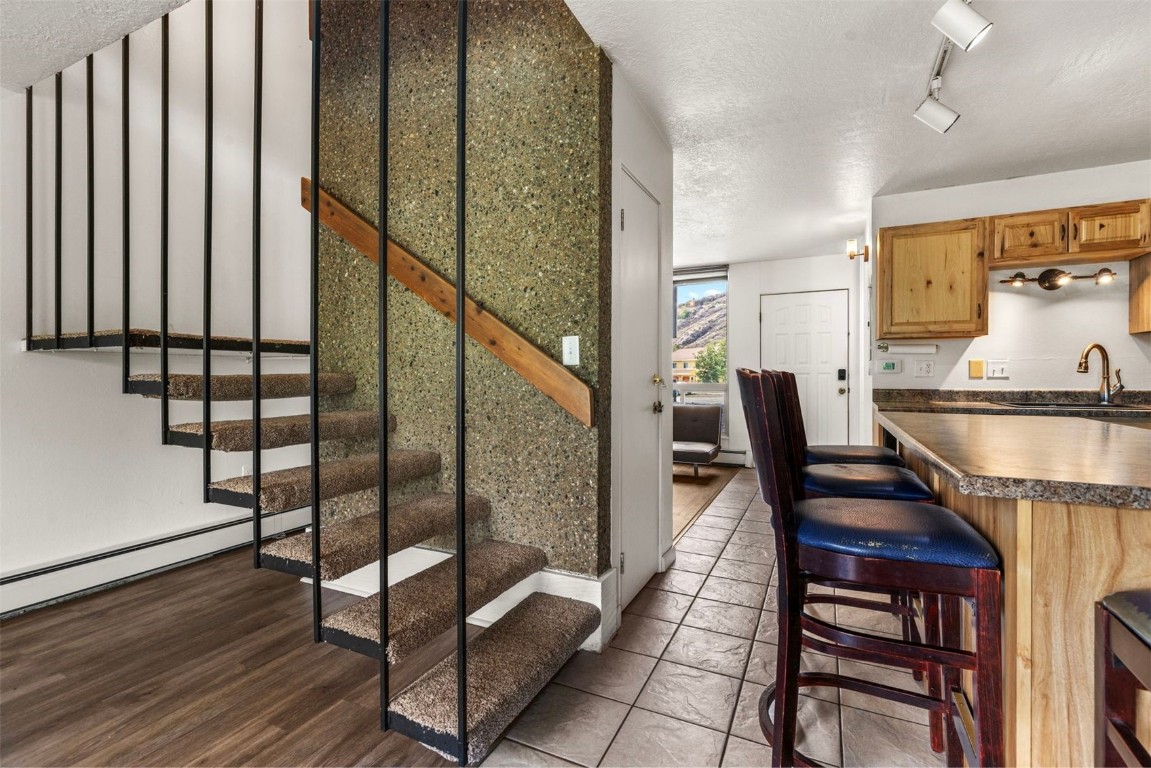 390 Straight Creek Drive, Unit 307 Dillon, CO 80435 - Photo 11 of 35 a workspace with wooden floor