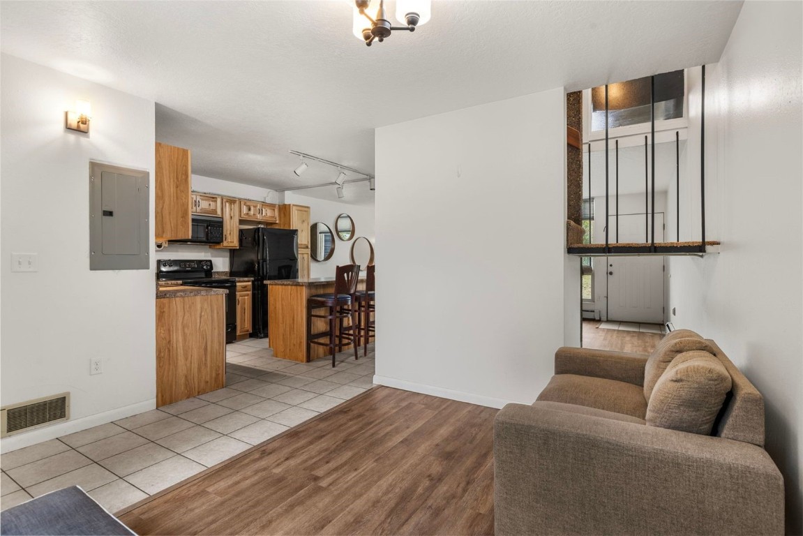 390 Straight Creek Drive, Unit 307 Dillon, CO 80435 - Photo 15 of 35 a living room with furniture and kitchen view