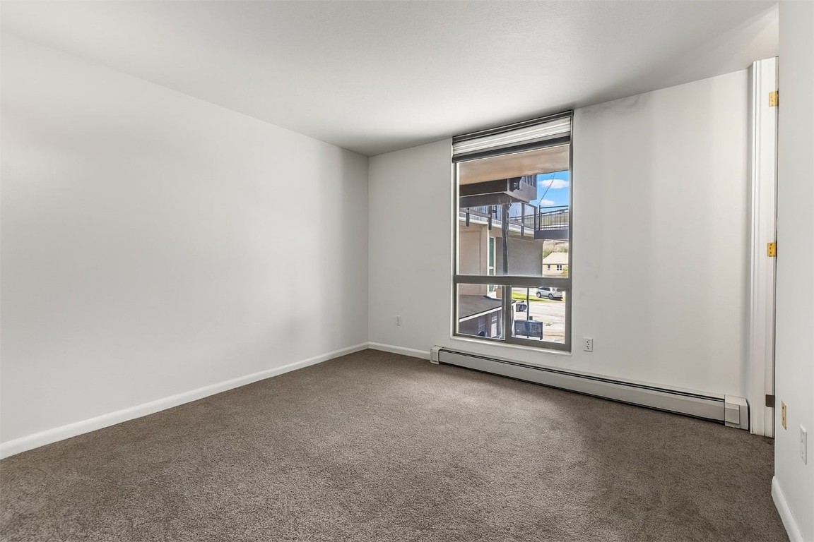 390 Straight Creek Drive, Unit 307 Dillon, CO 80435 - Photo 19 of 35 an empty room with windows