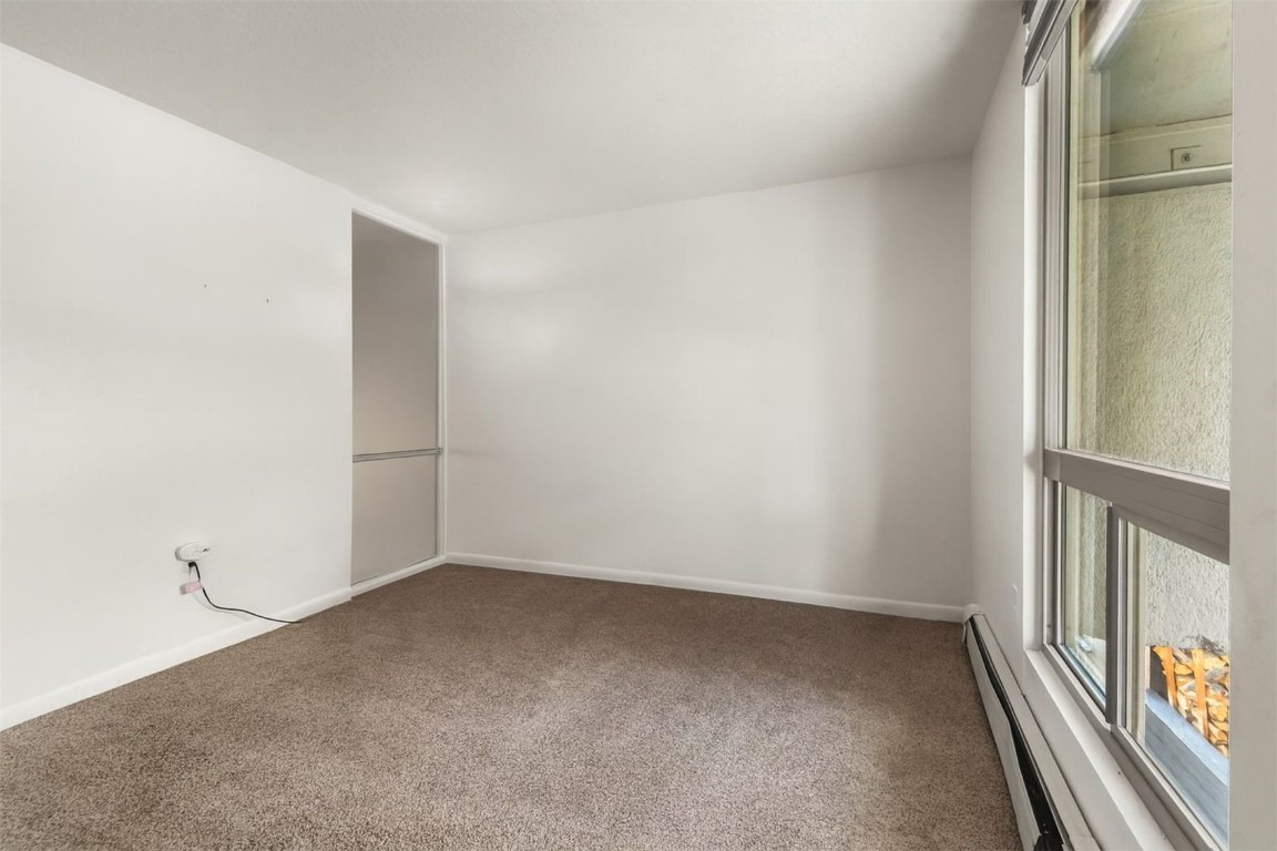 390 Straight Creek Drive, Unit 307 Dillon, CO 80435 - Photo 20 of 35 an empty room with windows