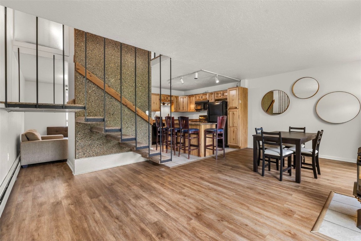 390 Straight Creek Drive, Unit 307 Dillon, CO 80435 - Photo 2 of 35 a living room with furniture and wooden floor