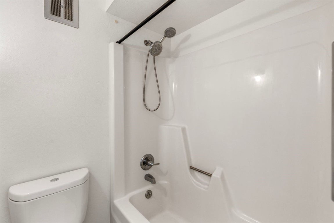 390 Straight Creek Drive, Unit 307 Dillon, CO 80435 - Photo 22 of 35 a bathroom with a shower a toilet and a shower