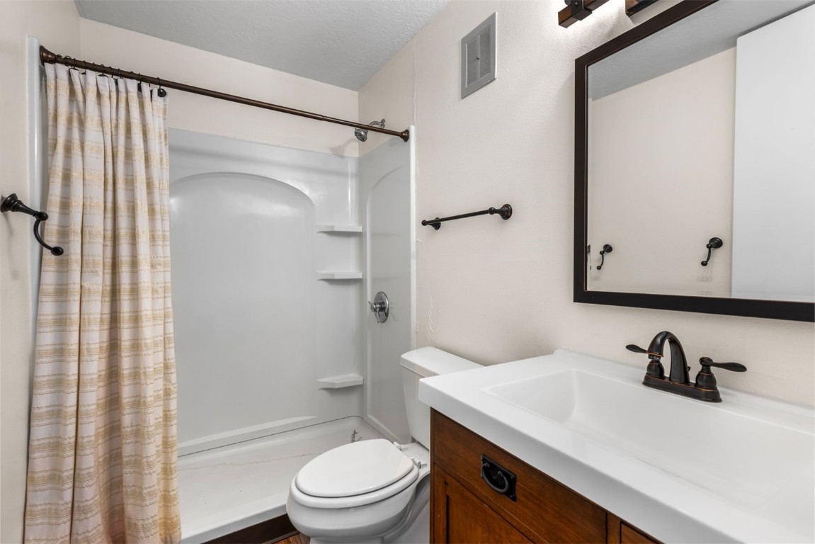 390 Straight Creek Drive, Unit 307 Dillon, CO 80435 - Photo 23 of 35 a bathroom with a sink a toilet and shower