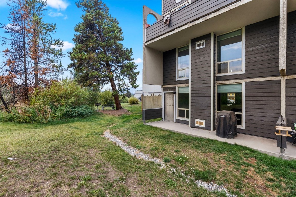 390 Straight Creek Drive, Unit 307 Dillon, CO 80435 - Photo 33 of 35 a view of a house with a yard and sitting area