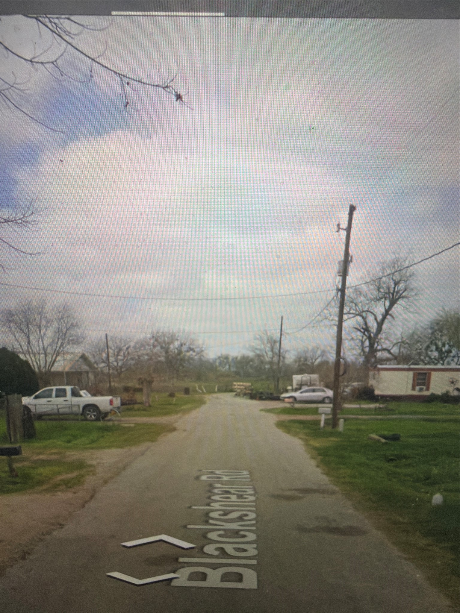 a view of a lake with houses in the background