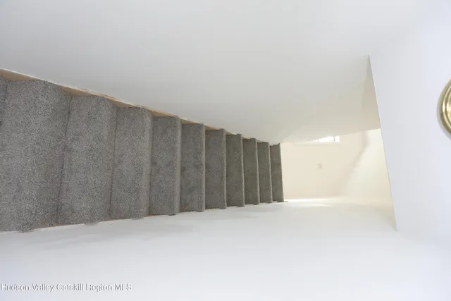 an empty room with a empty space and windows